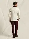 Man_in_cream_suit_walking_202606031718.webp
